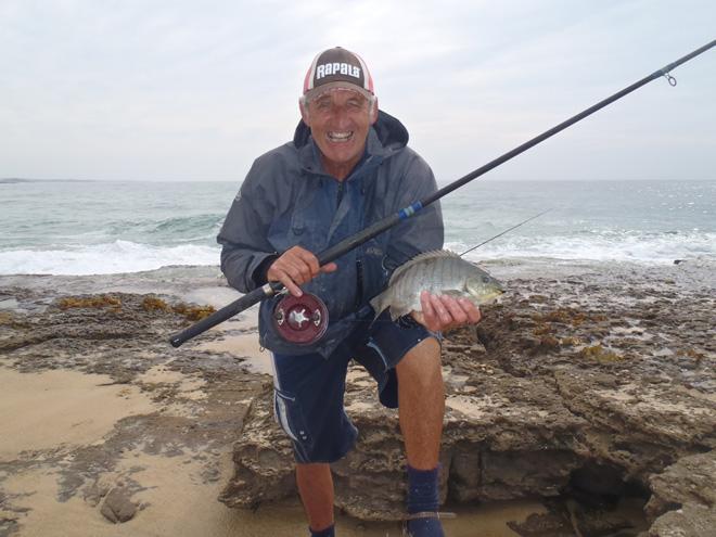 Alan Perry with a luderick that was caught while fishing the wash behind him. This was at the top of the tide. © Gary Brown
